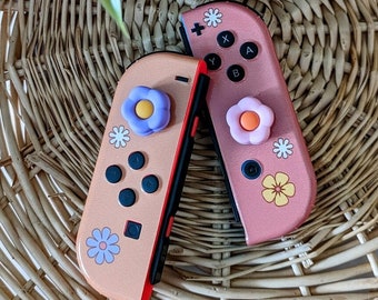 Empuñaduras para pulgares con diseño de flores en tonos pastel, tapas para Joy-Con con diseño de margaritas, decoración para videojuegos, empuñaduras de silicona para mandos.