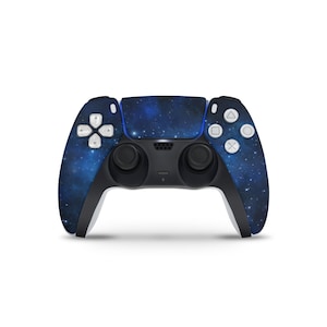 May include: A black and blue wireless game controller with a starry night sky design. The controller features a touchpad, directional buttons, and action buttons. The design covers the front and sides of the controller.