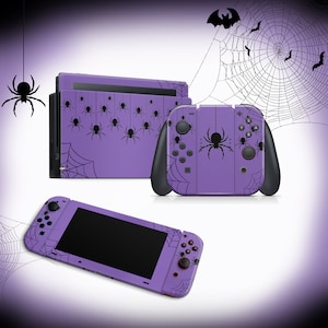 May include: Purple Nintendo Switch console and controller skins with a spider web and spider design. The console skin has a row of spiders hanging from a web. The controller skin has a large spider in the center.
