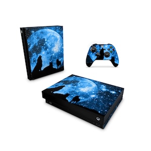 May include: A blue and black Xbox console and controller skin with a full moon and howling wolves design. The design features a large blue moon with stars and three wolves howling at the moon.