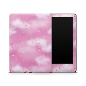 May include: A pink and gold e-reader case with a cloud and star pattern. The case is designed to fit a Kindle Paperwhite.