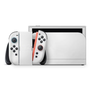 May include: A white Nintendo Switch console with attached Joy-Con controllers. The left controller has blue buttons, and the right controller has red buttons. The console is set against a white background.