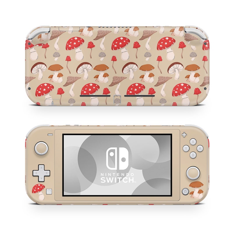 May include: A beige Nintendo Switch Lite console with a mushroom pattern skin. The console has a white screen and the Nintendo Switch logo is visible on the screen.