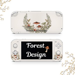 May include: White Nintendo Switch Lite console with a custom skin featuring a wreath of ferns and mushrooms. The screen displays the text "Forest Design".