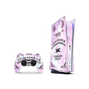 May include: A gaming console and wireless controller set featuring a pink and purple watercolor Ouija board design. The console skin displays the alphabet, numbers 1-9, sun, moon, and star motifs, with the text OUIJA SPIRIT BOARD, YES, NO, and GOOD BYE.