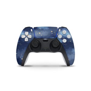 May include: A wireless game controller with a dark blue and gold starry night sky design. The controller has black handles and buttons with white symbols. The design covers the front and sides of the controller.