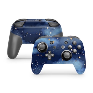 May include: A blue and gold Nintendo Switch controller with a starry night sky design. The controller has a textured surface and gold accents.