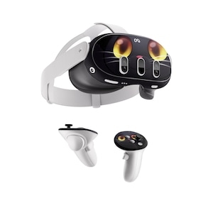 May include: A white and black VR headset with a cat-themed design on the front. The headset has a white strap and is accompanied by two white controllers. The cat design features large yellow eyes and whiskers.