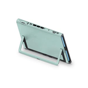 May include: A pale green tablet case with an integrated stand. The case has a smooth, contemporary design. The stand is built into the back of the case, enabling the tablet to be propped up at an angle for convenient, hands-free viewing.
