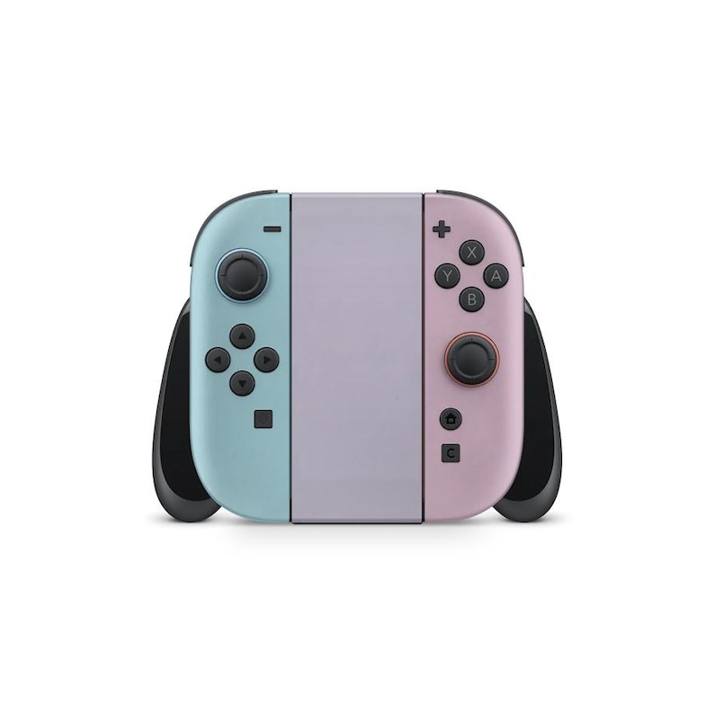 May include: A pastel-coloured Nintendo Switch console. The left Joy-Con is light blue, the right is pink, and the centre is lavender. Black control sticks and buttons are visible. The console is designed for handheld or docked gaming.