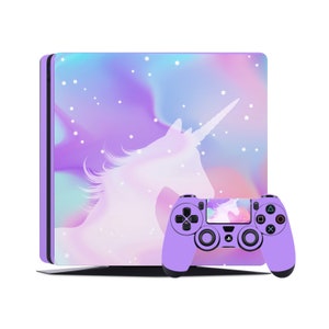 May include: A purple and white PlayStation 4 console and controller with a unicorn design. The console has a holographic background with stars and the controller has a unicorn silhouette on the touchpad.