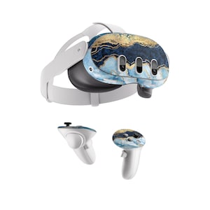May include: A white virtual reality headset with a blue and gold marble pattern on the front. The headset comes with two white controllers, each with a blue and gold marble pattern on the front.