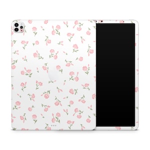 May include: White iPad case with a pink floral pattern. The case has a cutout for the camera and a white border around the screen.