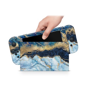 May include: A blue and gold marble patterned Nintendo Switch console skin. The skin is designed to fit the Nintendo Switch console and Joy-Cons.