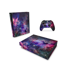 May include: A purple, pink, and blue galaxy-themed skin for an Xbox console and controller. The skin features a nebula with stars.