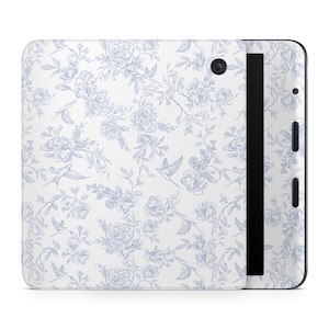 May include: A white tablet case featuring a blue floral and bird pattern. The design includes detailed illustrations of flowers, leaves, and birds, creating a delicate, vintage aesthetic. The case has a black border and a camera lens.
