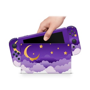 May include: Purple Nintendo Switch console skin with a crescent moon, stars, and clouds design. The skin is designed to fit the Nintendo Switch console and Joy-Cons.