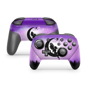 May include: Purple and black Nintendo Switch controller skin with a fairy silhouette flying around a crescent moon with stars. The background is a gradient of purple and pink with a galaxy-like pattern.