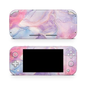 May include: A handheld gaming console with a marble design in pink, purple, blue, and gold. The console has a black screen and visible buttons. The top view shows the back of the console, while the bottom view shows the front.
