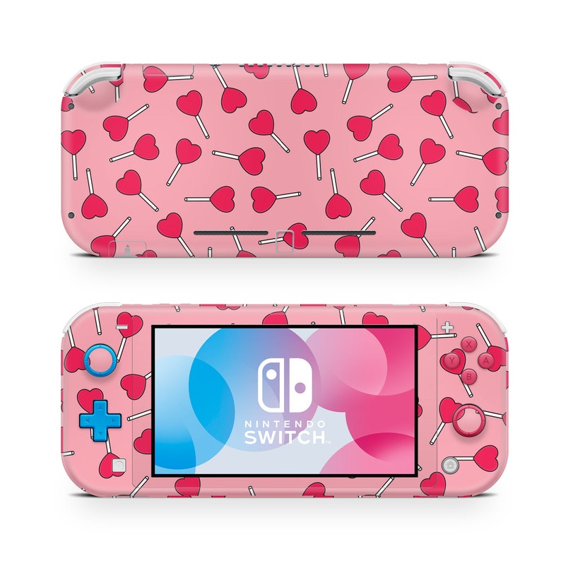 May include: Pink Nintendo Switch Lite console with a pink and white heart lollipop pattern. The console has blue buttons and a white Nintendo Switch logo.