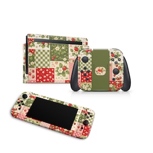 May include: A set of Nintendo Switch accessories featuring a patchwork design with strawberries, flowers, and green gingham patterns. The set includes a console, controllers, and a handheld device, all adorned with the same decorative motif.