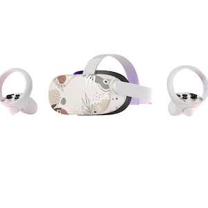 May include: A white virtual reality headset with a floral pattern on the front. The headset comes with two white controllers.