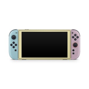 May include: A handheld games console with a black screen, light blue left controller, and pink right controller. The console has a gold-coloured frame around the screen and black buttons. The controllers have black buttons and joysticks.