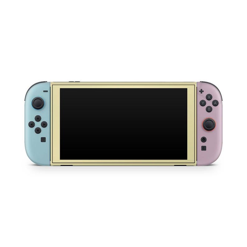 May include: A handheld games console with a black screen, light blue left controller, and pink right controller. The console has a gold-coloured frame around the screen and black buttons. The controllers have black buttons and joysticks.