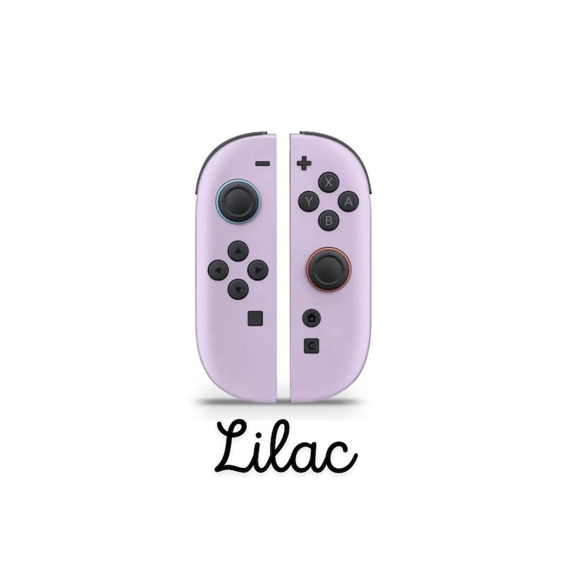 May include: Lilac-coloured game controllers with black buttons and directional pads. The controllers are split into two vertical halves, each with a set of buttons and a joystick. The word "Lilac" is written in cursive below the controllers.