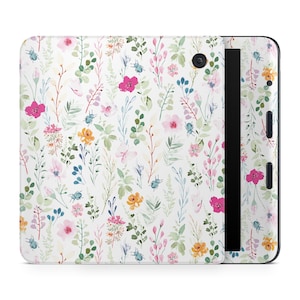 May include: A tablet case with a watercolour floral design. The pattern features pink, yellow, and blue flowers, green leaves, and small insects on a white backdrop. The case has a black vertical stripe and a camera lens.