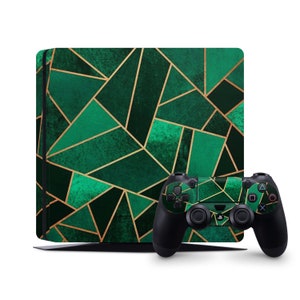 May include: A green and gold geometric pattern console and controller skin for the Playstation 4. The design features a green background with gold lines forming geometric shapes.
