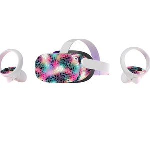 May include: A virtual reality headset with a colorful floral pattern on the front. The headset comes with two controllers, each with a white strap and a white ring.