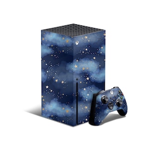 May include: A blue and gold Xbox Series X console and controller with a starry night sky design. The console has a textured surface and the controller has a smooth surface.