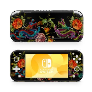 May include: A black Nintendo Switch Lite console with a colorful floral and dragon design. The design features red, pink, yellow, green, and blue flowers and dragons on a black background. The console has the Nintendo Switch logo and the text "NINTENDO SWITCH" on the screen.