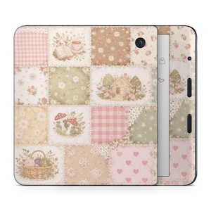 May include: A decorative Kindle cover with a patchwork design. The cover features squares with floral, gingham, and heart patterns in pastel colors. Illustrations include a house, mushrooms, a basket, and a teacup.