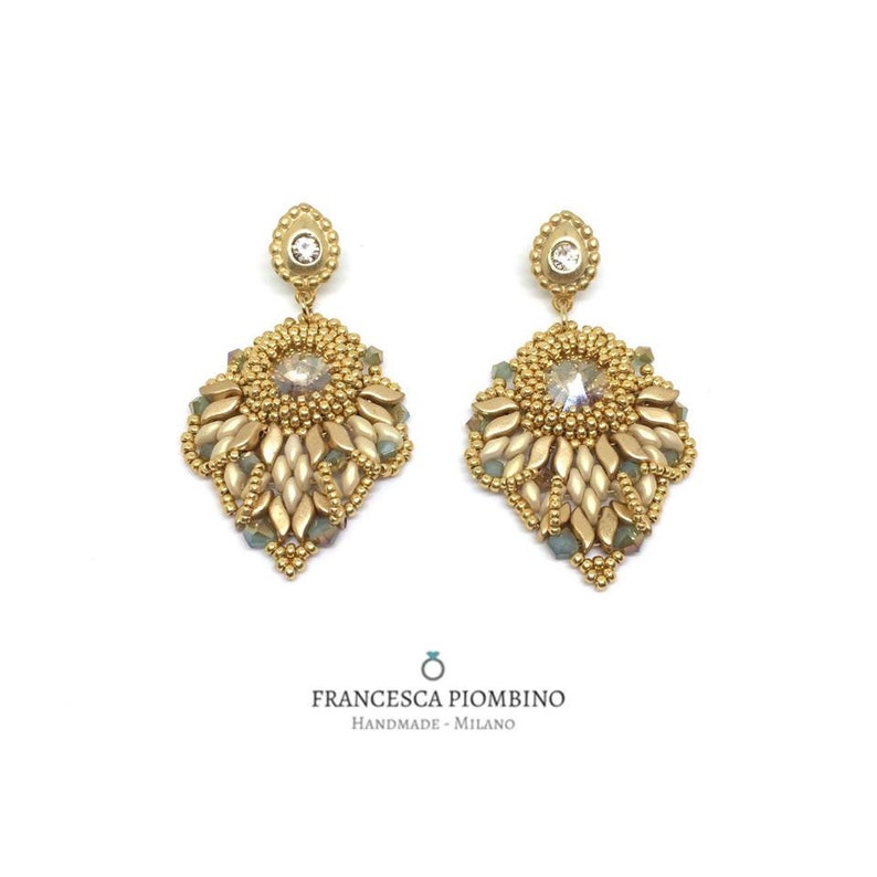 Hand-sewn gold earrings with beads and crystals.