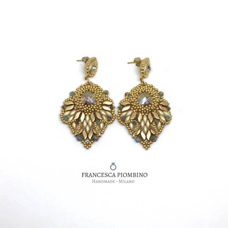 Hand-sewn gold earrings with beads and crystals.