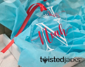 Personalised Acrylic Christmas Bauble Printed with name laid over decretive letter & ribbon detail