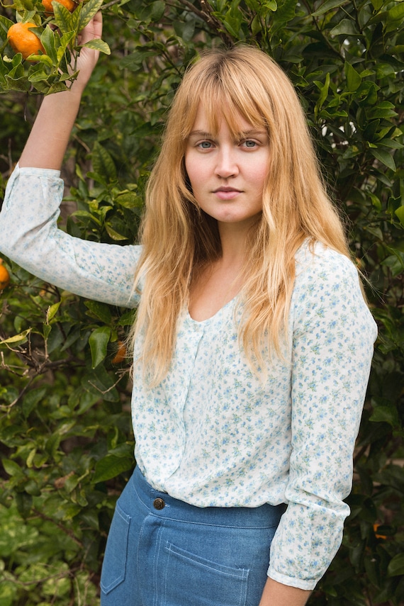 Found faded blue floral blouse