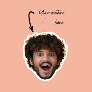 May include: A photo cutout of a person's face with curly brown hair. The person is smiling with their mouth open and their eyes wide. The cutout is on a pink background.