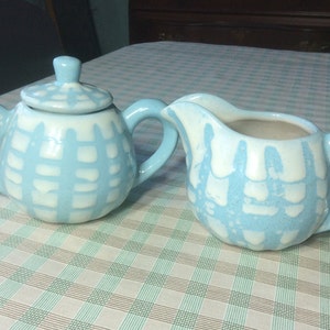 Hand thrown pottery speckled blue and white covered sugar and creamer set - signed