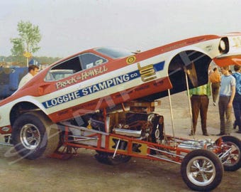 This is an 4 x 6" Color Photo of Prock & Howell In A Logghe Stamping F/C