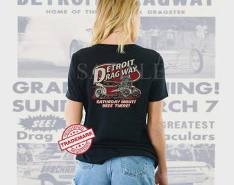 Detroit Dragway® SATURDAY Night bee there Ladies T-Shirt Black Short Sleeve Shirt Image On BACK