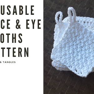 May include: White, crocheted face and eye cloths with loop handles are stacked on a wooden surface. The text "REUSABLE FACE & EYE CLOTHS PATTERN" is displayed in black, along with "HOOKS & TANGLES".