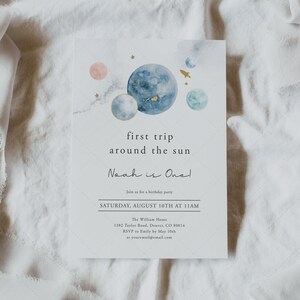 May include: A blue and white watercolour illustration of planets and a rocket ship with the text "first trip around the sun Noah is One!" Join us for a birthday party Saturday, August 10th at 11am. The William Home 1382 Taylor Road, Denver, CO 80014 RSVP to Emily by 10th May at youremail@email.com