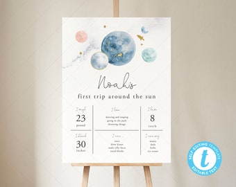 May include: A printable baby milestone chart with a space theme. The chart features a watercolor illustration of planets and stars in shades of blue, green, and pink. The text "Noah's first trip around the sun" is written in a handwritten font. The chart includes sections for the baby's age, weight, height, and milestones.