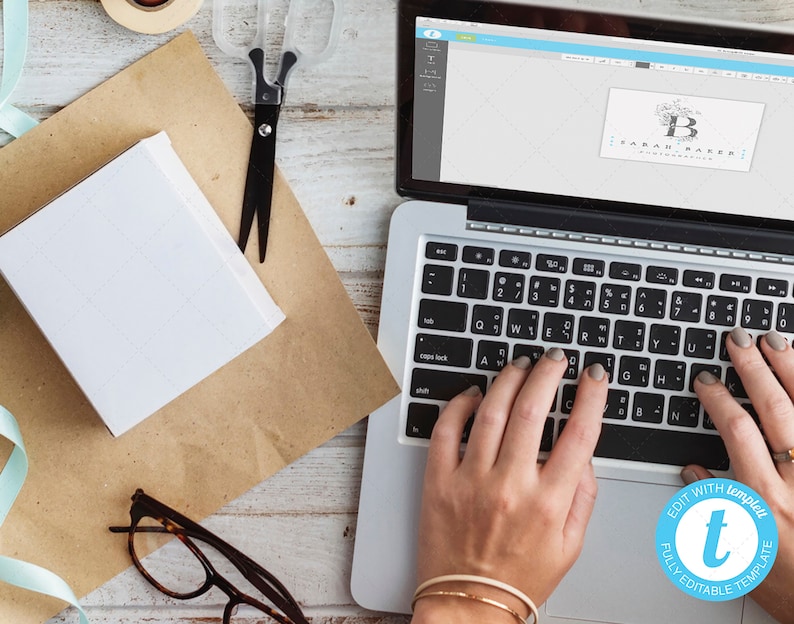 May include: A person is using a laptop to edit a logo design. The logo is for "Sarah Baker, a handcrafted blog". The laptop screen shows a design template with a floral motif and the text "EDIT WITH Templett FULLY EDITABLE TEMPLATE".