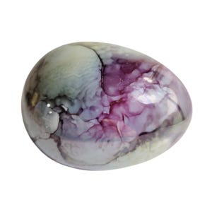 May include: A decorative, egg-shaped object with a marbled design. The colors include shades of purple, white, and gray, creating a swirling, abstract pattern. The surface is smooth and glossy, reflecting light.