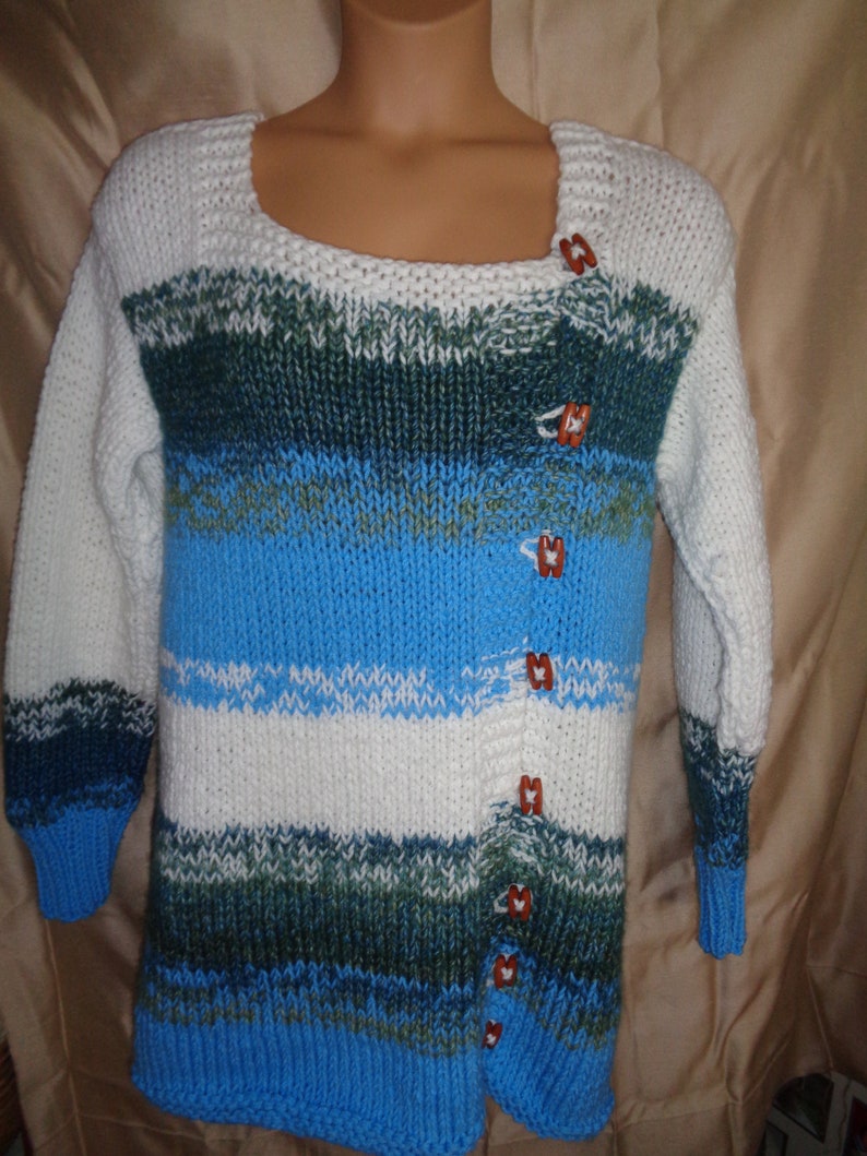 Sweater jacket in white bright summer sky blue and bluegreen variegated yarn Warm and comfy for outside. Size 1X 22-24