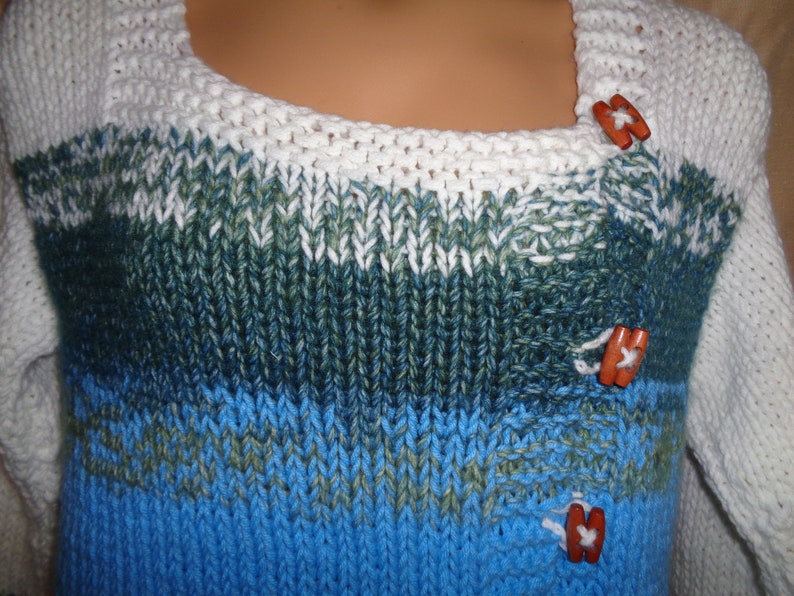 Sweater jacket in white bright summer sky blue and bluegreen variegated yarn Warm and comfy for outside. Size 1X 22-24